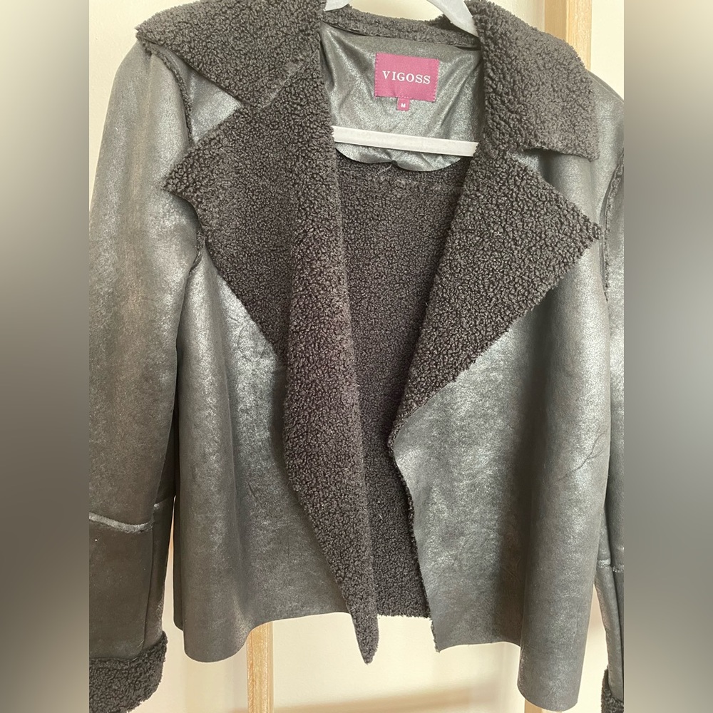 Faux leather with Sherpa lining, open front bomber style jacket